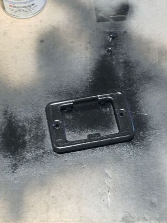 Three light coats of Rustoleum Satin Black on the cover plate and screws. 