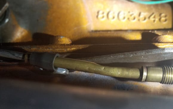 Shifter rod on transmission bracket.