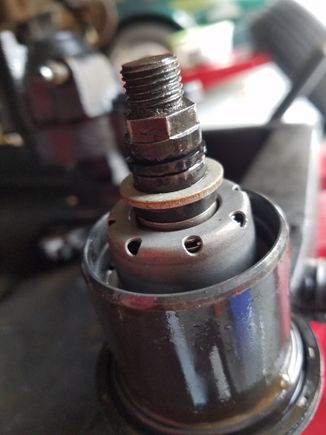 Right.  Notice thrust washer position.  Sitting off the piston, supported by the actuator screw.