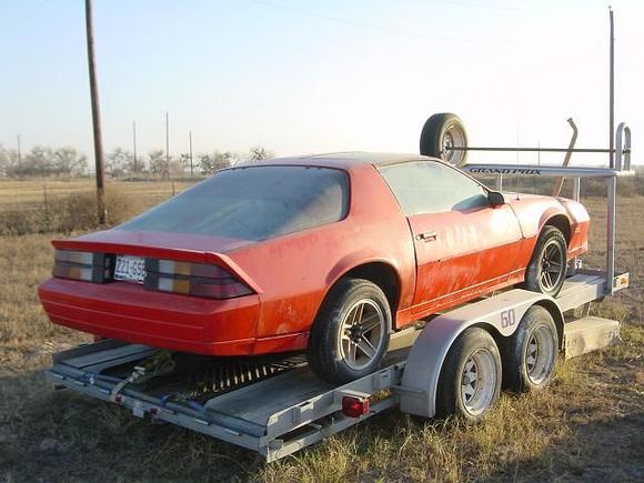 It sat for a couple of years at my friend's place out in the country before I was able to get started on it.  The taillights were spider cracked and brittle, and the paintjob was horribly orange peeled.  I still have the original bumpers and ground effects.