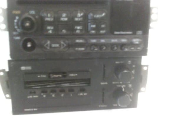 top radio is the CD with small pins
bottom is the stock 84 unit with big pins