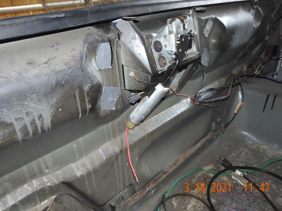If you zoom in you can see the tan colored plastic head on the cable  from the solenoid which contacts the lock release.