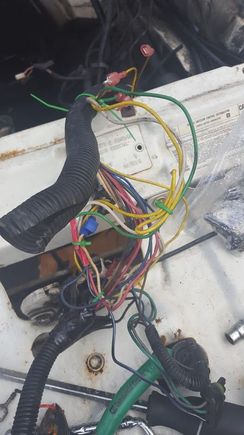 This was the mess in front of the radiator spliced into the headlight wiring. I bought another headlight harness and a brand new isolation relay so i can get the light working properly.