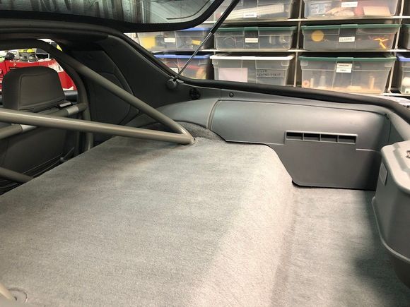 the factory covered this large expanse of plastic with carpeting, but molding was needed to address all the complex curves