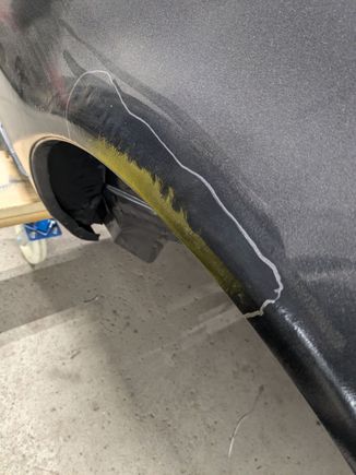 This is some weird rippling on the rear fender well.  I will be getting a PDR shop to look at this to see if it can be worked out a bit to avoid having to fill it.