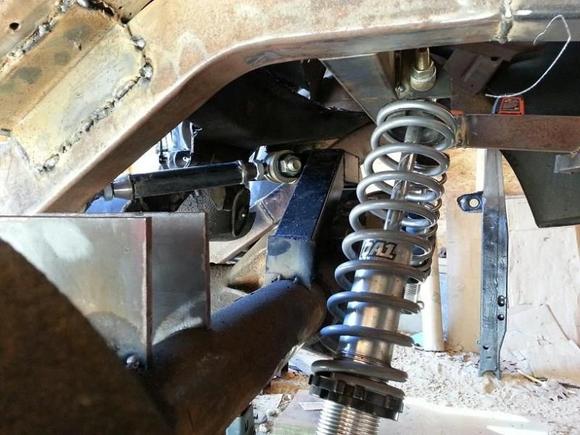 Custom narrowed 2x3 frame rails, custom triangulated 4 link, coil overs