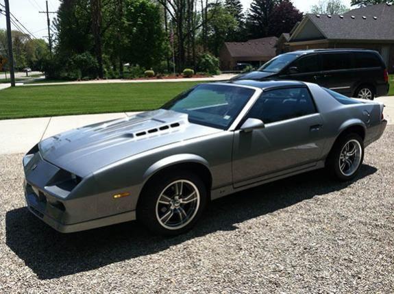 Camaro with new wheels and tires before hood work and black decals