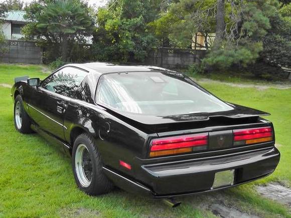Rear angle shot of a 1992 Pontiac Firebird Trans Am sold brand new in Japan by the GM dealership there. Notice the "fold away" door mirrors.