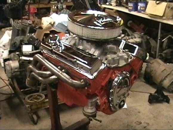 5.7 liter 350 4 bolt main, edelbrock torker II intake, Edelbrock Headers, Double roller timing chain, mild cam, holley 650 carb