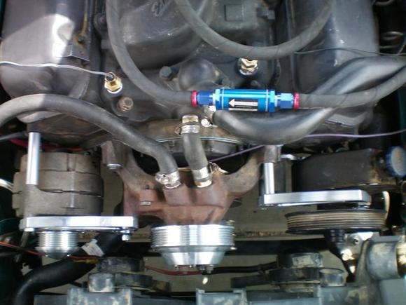 March Performance mid mount serpentine conversion (water pump/alternator overdrive ratio).  Stock PS pump re used.
