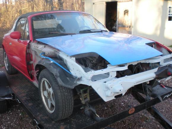 starting to look like a drivable car again...found the hood on craigslist for 100.00.....still trying to find a nose and pass. side fender.......ahhh