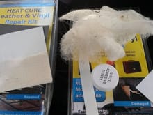 cotton fluff remains an vinyl repair glue that bonds the repair cloth to the rips