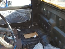 truck bed liner, did the doors on the inside too. the passenger door got some plastic taped on to prepare for the trim