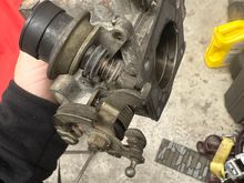 I see the dash pot screw is missing here 