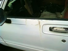 drivers door with major rust out the patch is riveted an bondo'ed over it needs replaced