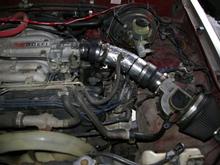 Cold air intake mod, using 3" electrical conduit sweep.  Wrapped with reflective tape afterwards.