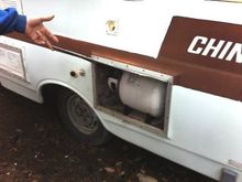 I need to install straps to hold the propane tank in place. There is my only missing hubcap, if anyone has two of them I'd like to buy them. the wheels are going to go black with chrome valve stems and red anodized aluminum valve caps. The brake drums and calipers will be red. The water fill and water outlet mechanisms (for lack of a better word) need redone. I want the end look to be cleaner, the two vents you see towards the front will be removed completely.