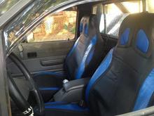 bucket seats do have cover over them, i love drivers side one has bottom adjustment as well as side adjustment for that more "bucket" feeling