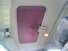 reupholstered sunroof cover (to her liking) used elmers spray on glu and a meter of polyester