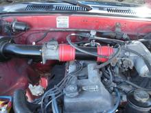 pic of the intake pipe i welded up.  the 3rze does not take up a lot of space in the engine bay.  look at all the room for the turbo charger.....