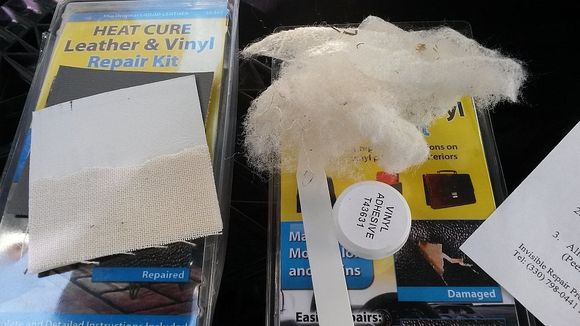 cotton fluff remains an vinyl repair glue that bonds the repair cloth to the rips