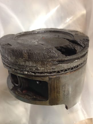 Melted hole right through piston!!