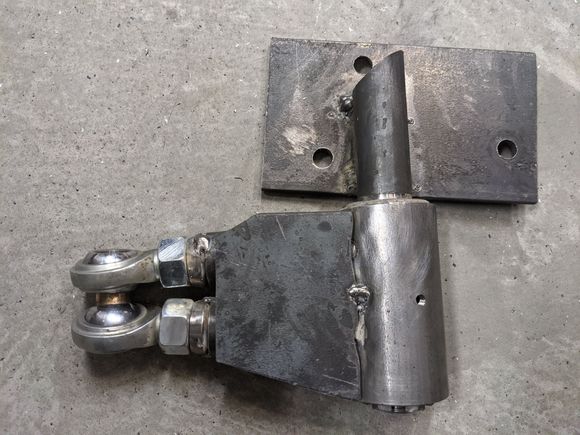 Here you can see the simple mount. And gusset. I am using 1/4" steel. I had to cut the spindle top to be able to mount the spindle as high as I need it and clear the bolt. I could have made my arms another 3/4 longer and move the whole thing further back on the plate. The spindle would clear the bolt. BUT, I decided the arm being short is important. I did have to make sure radius was enough not to mess up the steering geomtery. Also, I decided a gusset on one side was more than enough. 