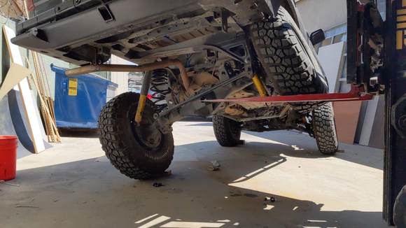 Got me 26 inch flex. Limitted  by linkage. I thought, hmmm... without the huge step of a long arm install and gas tank relocate, I think I can get another few inches out of this stock linkage mounting points. So after lots of time and another cringe worthy expense...  