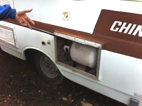 I need to install straps to hold the propane tank in place. There is my only missing hubcap, if anyone has two of them I'd like to buy them. the wheels are going to go black with chrome valve stems and red anodized aluminum valve caps. The brake drums and calipers will be red. The water fill and water outlet mechanisms (for lack of a better word) need redone. I want the end look to be cleaner, the two vents you see towards the front will be removed completely.