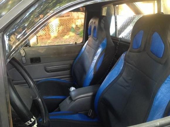 bucket seats do have cover over them, i love drivers side one has bottom adjustment as well as side adjustment for that more "bucket" feeling