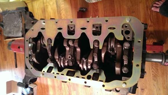 Image of the LCE Oil Crank Scraper installed.  I'm running a separate oil cooler, and remote dual ford 3001 filter set up on the rig.  I'm estimating she will take 7-8 quarts of Royal Purple to fill her up, and with the adjustable oil pressure bypass, high oiling rocker arms, HD oil pump, and cooler, I figured a crank scraper would help keep the oil from foaming in the pan, and ensure that the pick up was always submerged.  It's normally a racing guy thing to keep extra weight off your rotating assembly, but I got it to keep my oil where it's supposed to be.