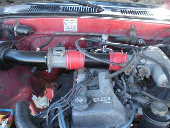 pic of the intake pipe i welded up.  the 3rze does not take up a lot of space in the engine bay.  look at all the room for the turbo charger.....