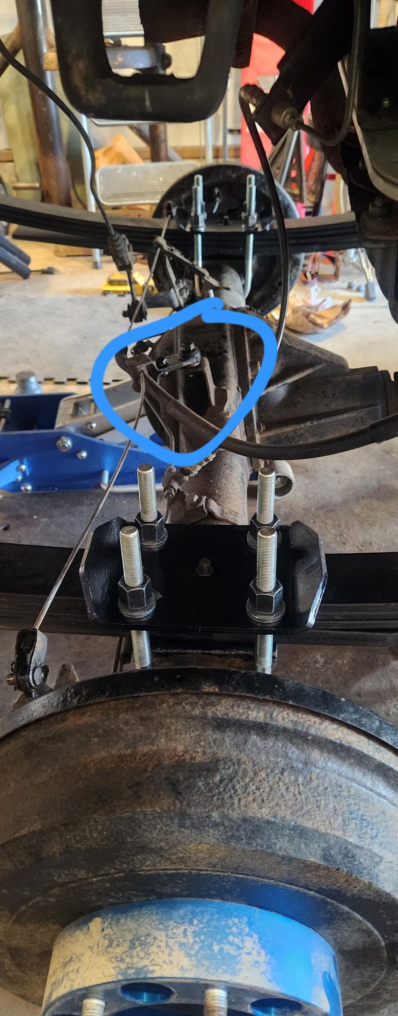 So i tried to unbolt this hinge here thinking it might give me enough play in the cable for the shafts to pull out. But the previous owner or whoever once again i had other plans. The actual hinge bolt that the assembly pivots on. The nut for that bolt completely stripped. Both bolt heads looked great fortunately. After using the kit again, was a bit of a pain but managed to get the nut off.