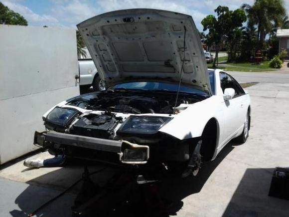installing coilovers and changing rims, exhaust, and bumper