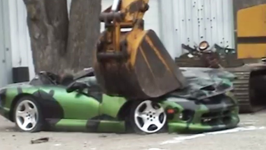 A Dodge Viper donated for educational purposes being crushed