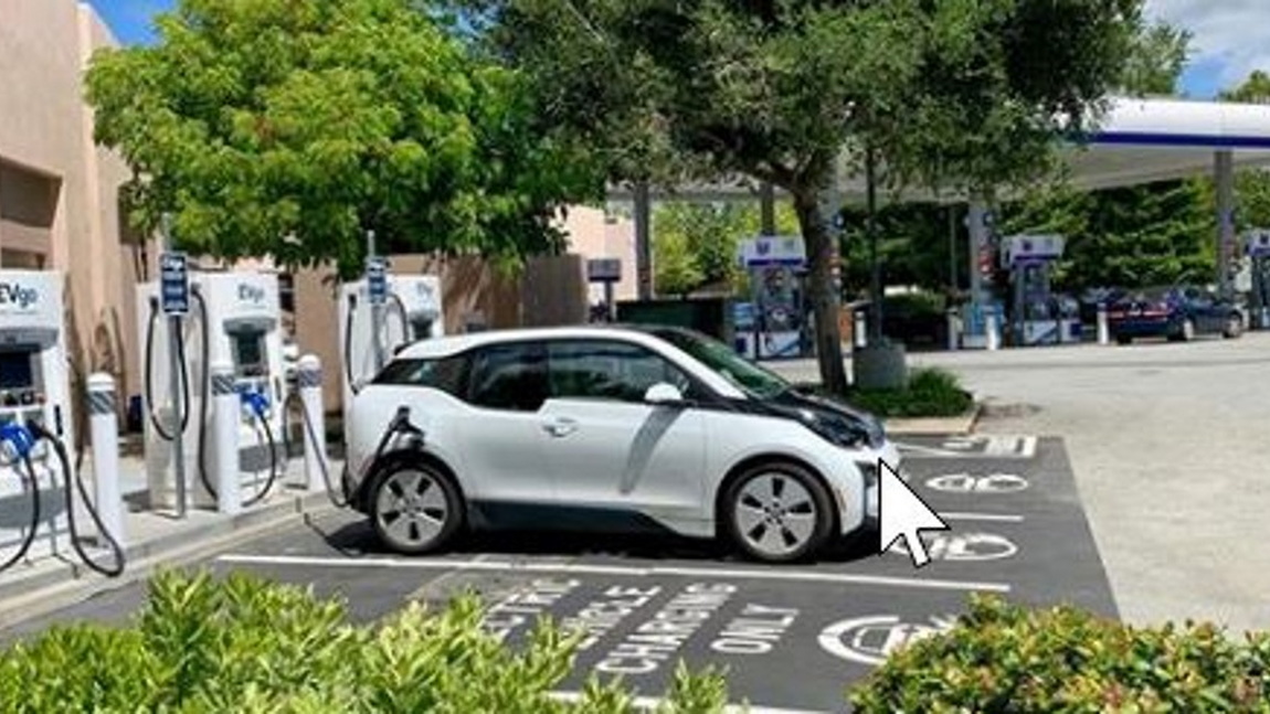 BMW i3 charging at EVgo fast chargers at Chevron station, Menlo Park, California