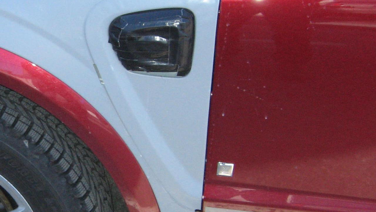 detail of spy shot showing GM Two-Mode Plug-In Hybrid being tested in Saturn Vue mule