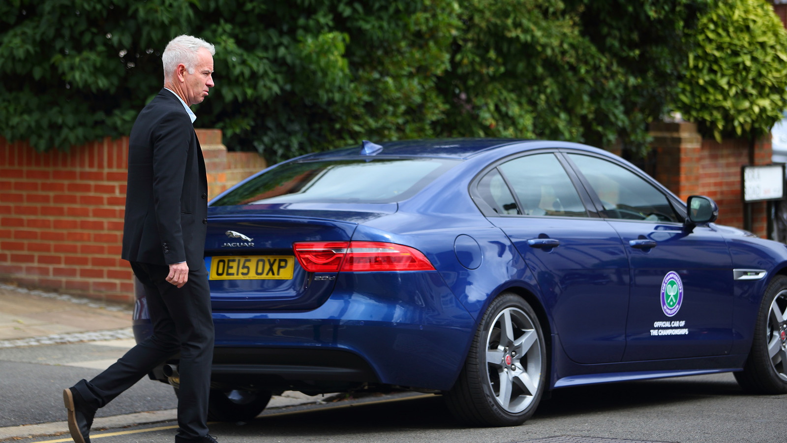 John McEnroe drives the new Jaguar XE at Wimbeldon