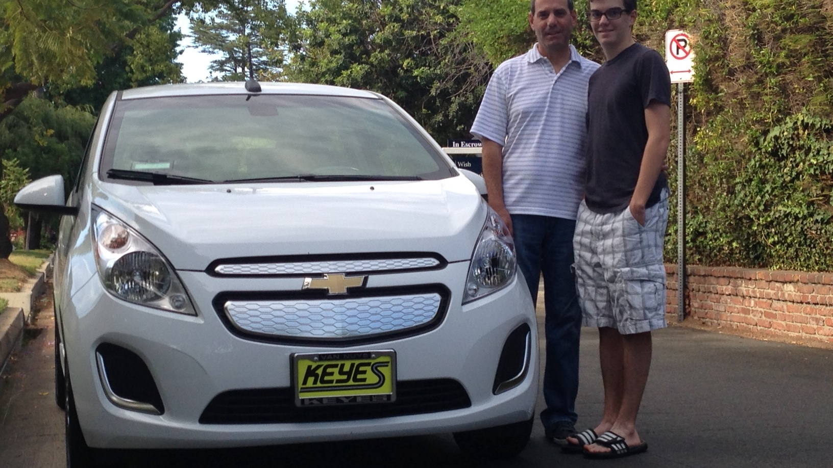 Rick and Alex Prell with new 2014 Chevrolet Spark EV, Studio City, CA