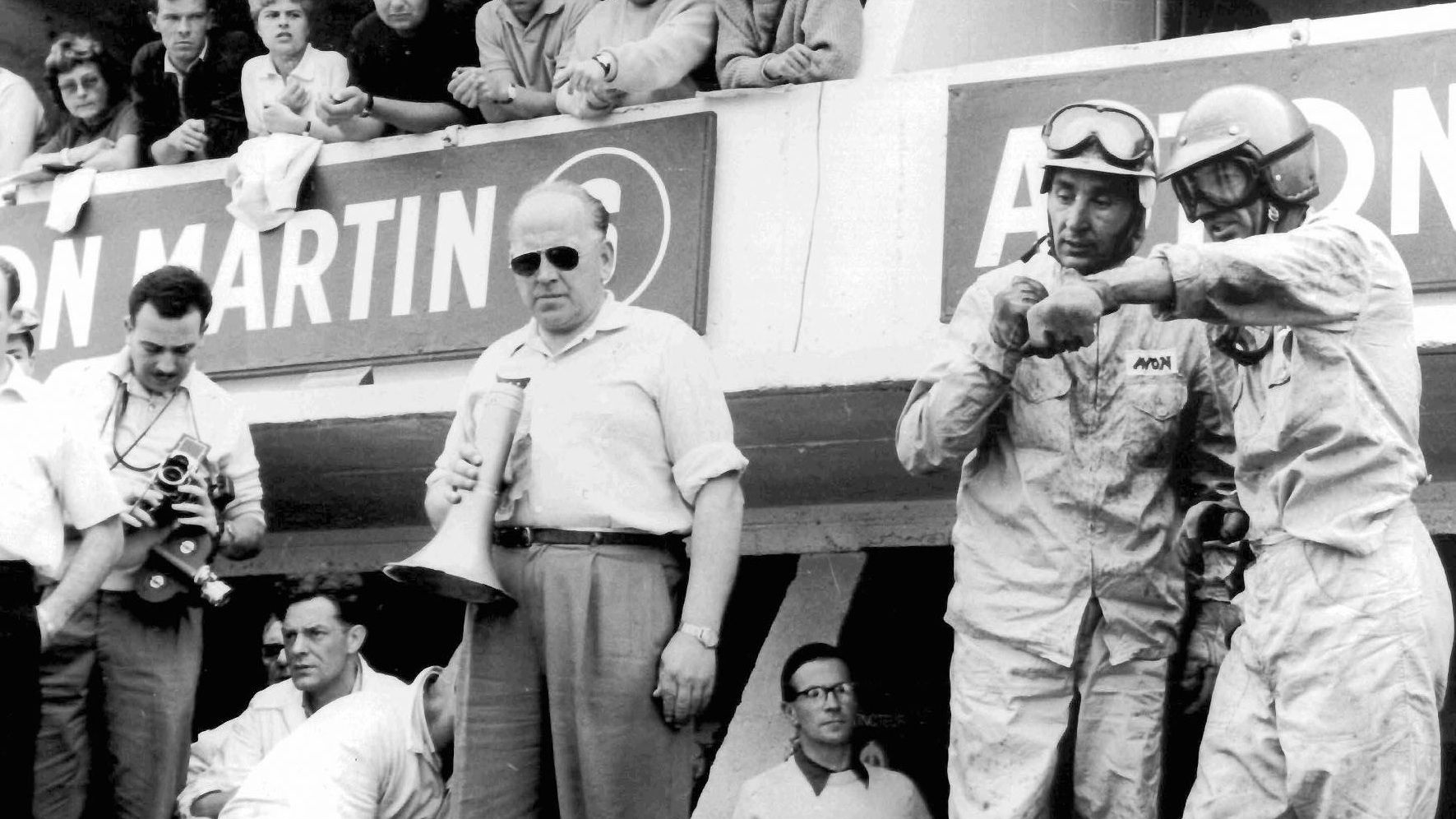 CS-WNRIR] Carroll Shelby, 450S Maserati owner John Edgar (dark glasses) and  Jan Harrison (flag), after the win - November 17, 1957 - William Edgar  Archive