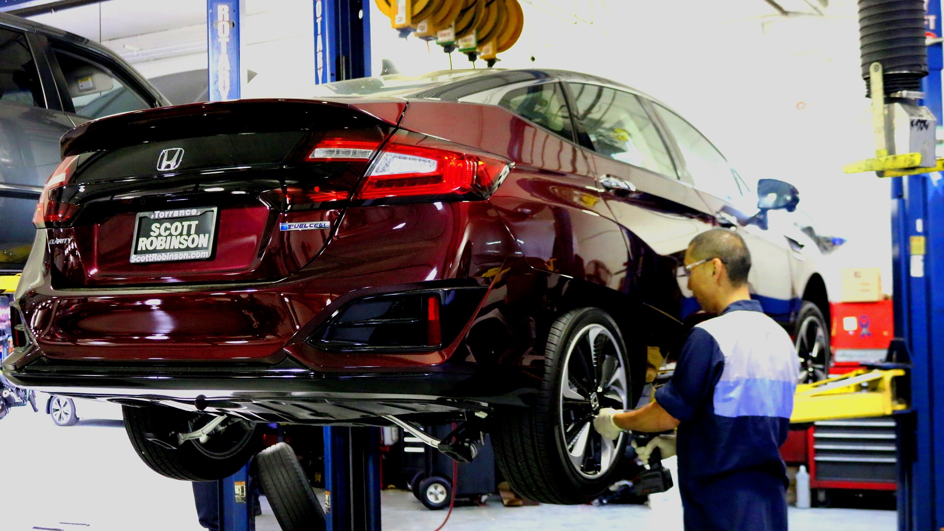Service technician working on Honda Clarity Fuel Cell at dealership