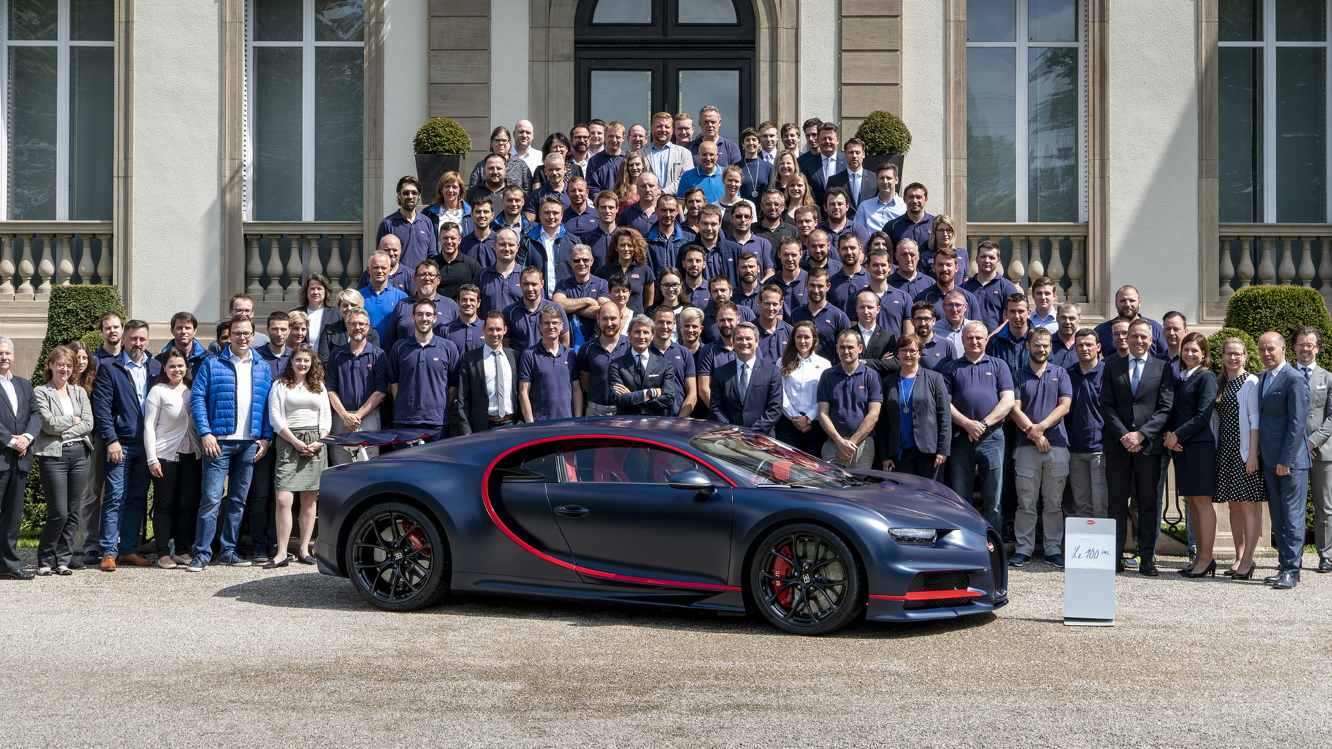 Bugatti staff and the 100th Chiron at Bugatti’s headquarters in Molsheim, France