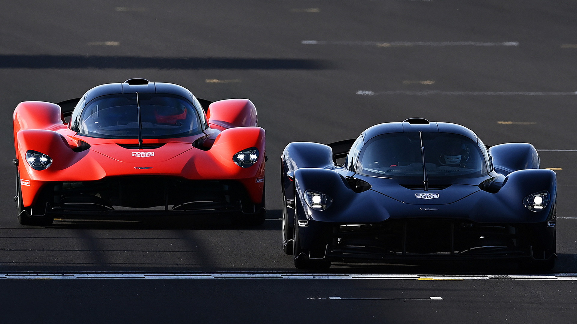 Red Bull Racing F1 drivers Max Verstappen (left) and Alex Albon test the Aston Martin Valkyrie