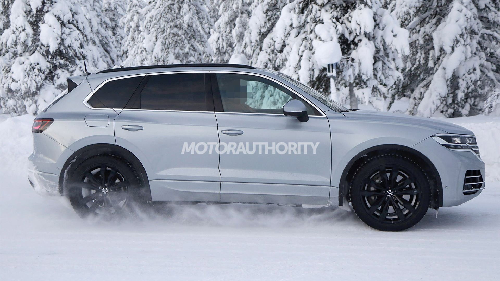 VW Touareg Facelift Rendering Tries To Peel Off Stickers From Spy Shots