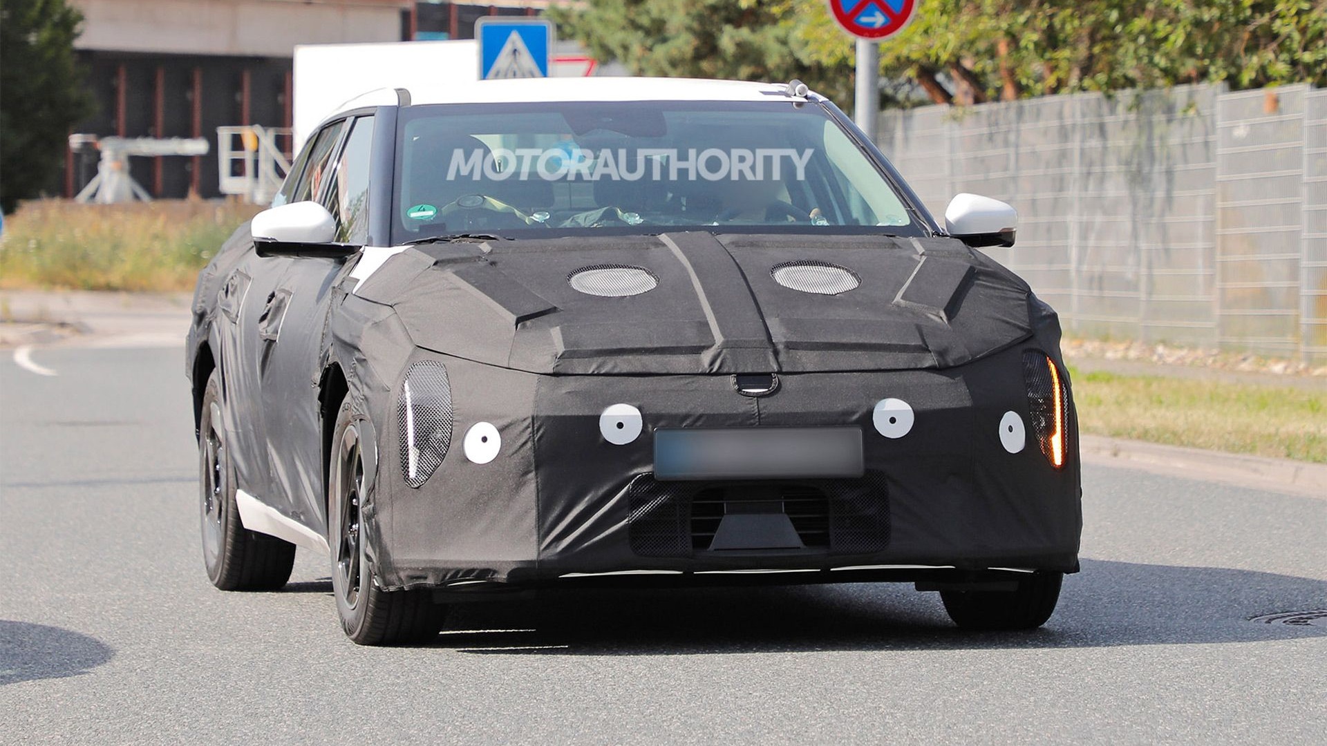 2026 Kia EV4 spy shots - Photo via Baldauf