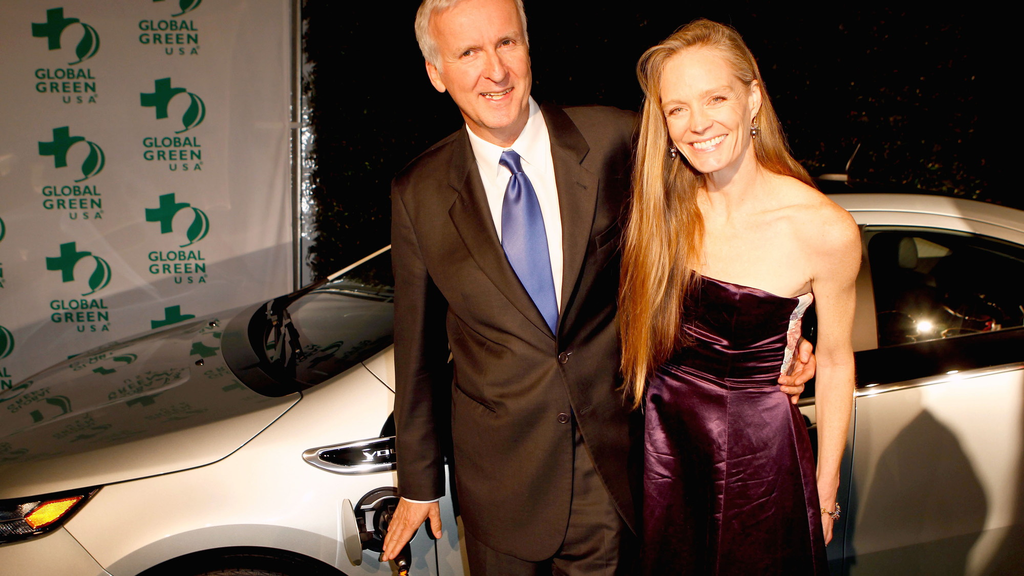 James Cameron, Suzy Amis with 2011 Chevy Volt at Global Green Pre-Oscar Party, Feb 2011
