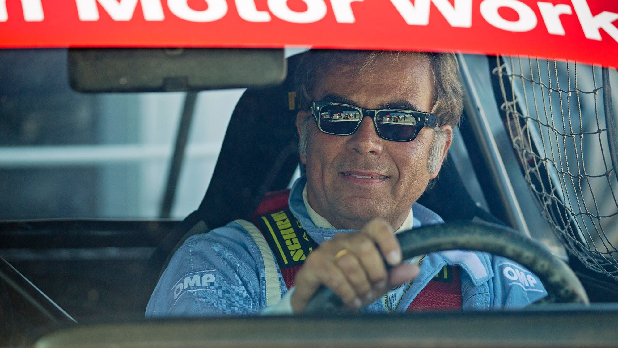 BMW NA CEO Ludwig Willisch drives the 1975 No. 25 3.0 CSL IMSA race car at the Rolex Monterey Motors