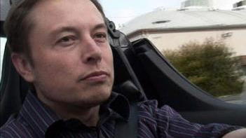 Tesla Motors CEO Elon Musk at the wheel of a Tesla Roadster