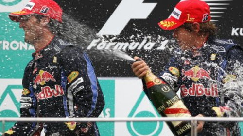 Red Bull's Sebastian Vettel and Mark Webber on the podium at the 2010 Malaysian Grand Prix