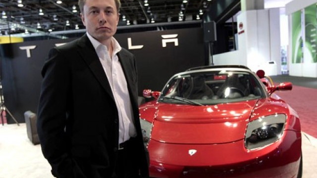 Tesla Motors CEO Elon Musk with Tesla Roadster
